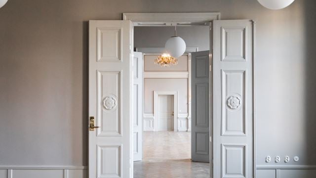 Illustration av fastigheten Börshuset i Malmö i skymningen.