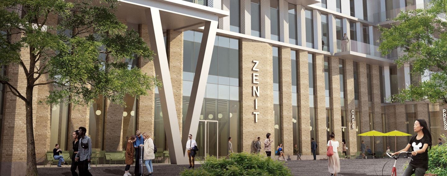 Innovationshuset Zenits fasad, med höga fönster och träd i förgrunden.