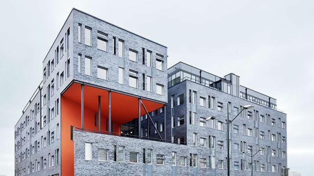 A grey and red building for Region Skåne in Dockan, Malmö.